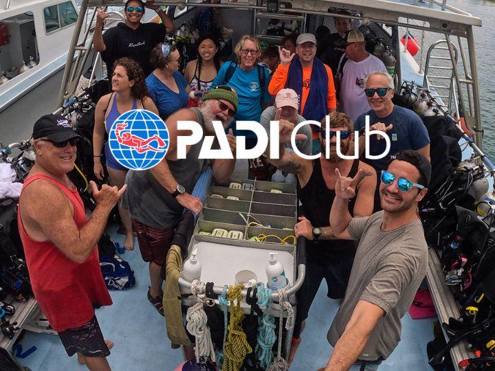PADI Club promotion with people on a boat.